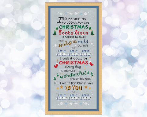 Christmas Songs cross stitch pattern. A large pattern of a poem made up of popular Christmas song titles. Shown with frame.