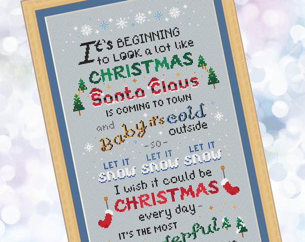 Christmas Songs cross stitch pattern. A large pattern of a poem made up of popular Christmas song titles. Close up of upper half of pattern.