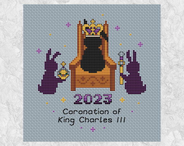 Coronation Bunnies cross stitch pattern. A bunny wearing a crown sits on a throne, with a bunny with an orb on one side and a bunny with a sceptre on the other. Shown without frame.