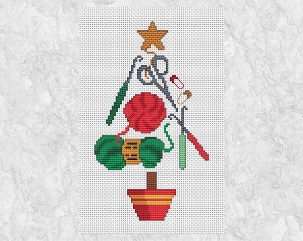 Crochet Christmas Tree cross stitch pattern. A Christmas Tree shape made up of yarn, scissors, crochet hooks and stitch markers - and ideal picture to cross stitch for any crochet lover. Shown without frame.