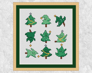 Dancing Christmas Trees cross stitch pattern. Nine cute mini Christmas trees. Shown with frame.