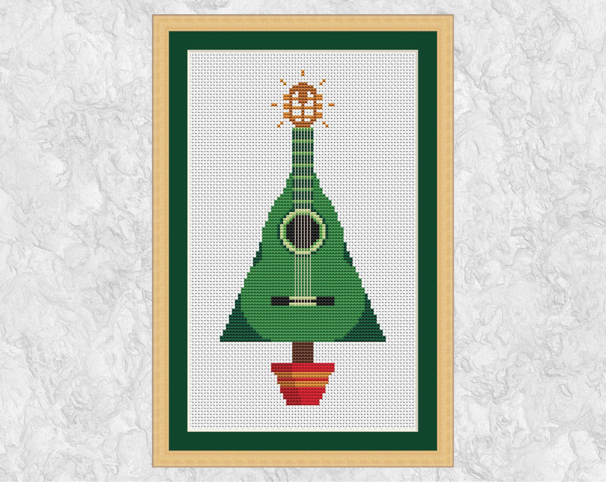 Guitar Christmas Tree cross stitch pattern. Shown in frame.
