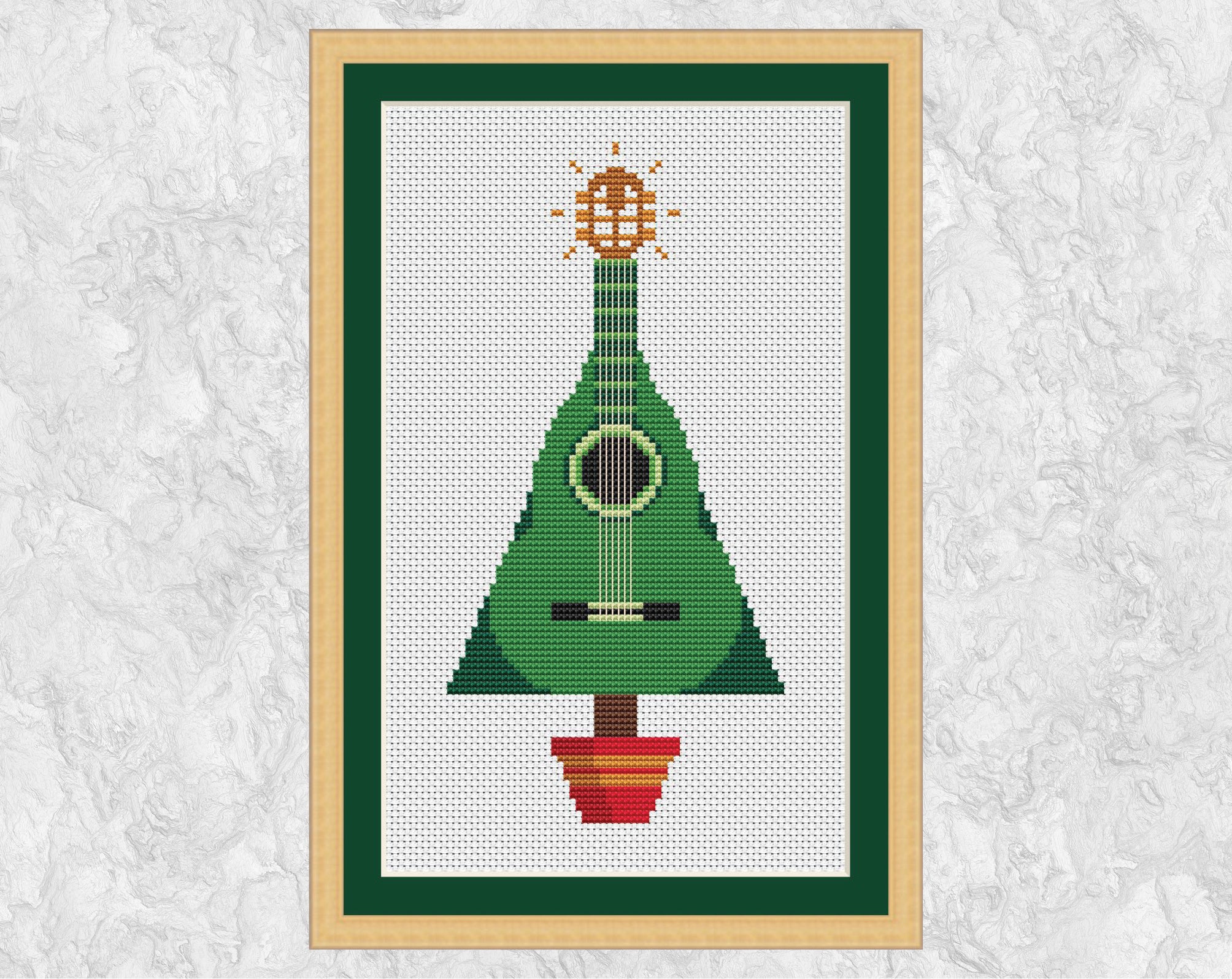 Guitar Christmas Tree cross stitch pattern. Shown in frame.