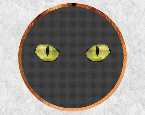 Cat's Eyes cross stitch pattern. Shown in hoop.