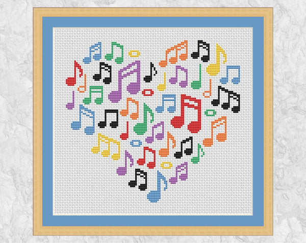 Larger Music Notes Heart cross stitch pattern. Shown with frame.