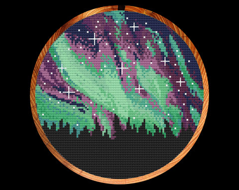 Northern Lights cross stitch pattern. Shown in hoop.