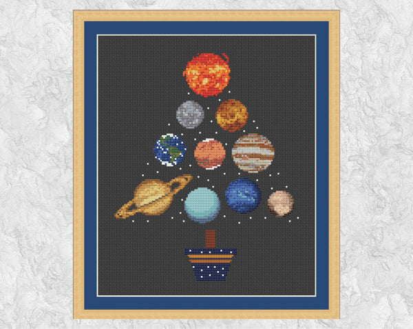 This fun Planets Christmas Tree cross stitch pattern is made up of all the planets in the Solar System, along with the Sun and Pluto. The planets are all accurately designed from NASA images as much as possible given the limitations of size. Shown with frame.