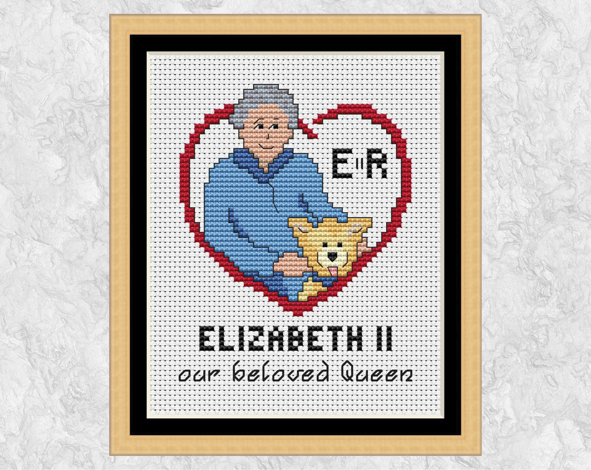 Queen Elizabeth II cross stitch pattern. Shown with frame.