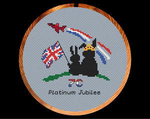 Platinum Jubilee cross stitch pattern. Two bunnies watching with a union flag watching a flypast. Shown in hoop.