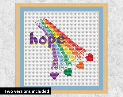 Rainbow of Hope cross stitch pattern - section of rainbow with hearts coming out of the end. This version has the word 'hope' on it and is shown with a frame.