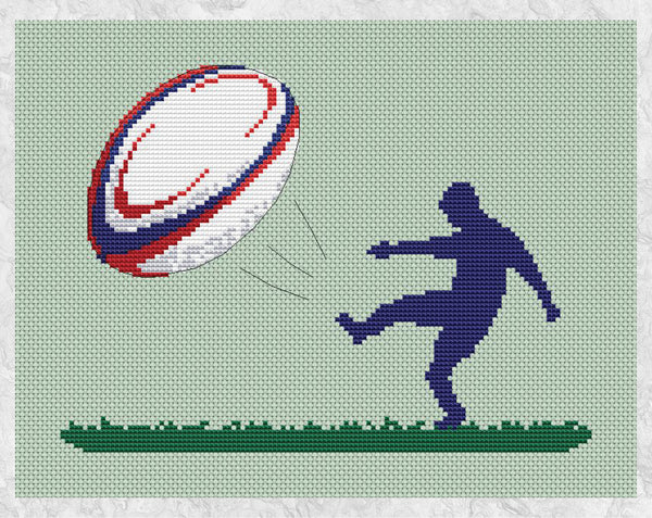 Cross stitch pattern of the silhouette of a rugby player kicking a large colourful rugby ball. Shown without frame.