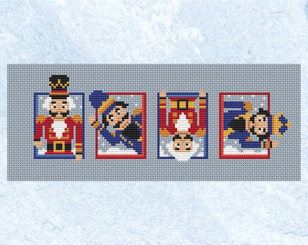 Set of Nutcrackers cross stitch pattern. Four mini Nutcracker soldiers leaning out of boxes at different angles. Shown without frame.