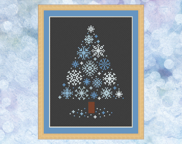 Snowflakes Christmas Tree cross stitch pattern - xmas tree made up of small snowflakes. Version with pale blue snowflakes on black fabric, shown with frame.