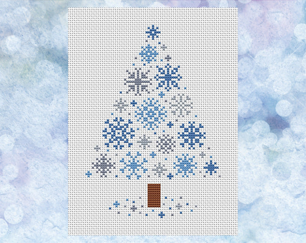 Snowflakes Christmas Tree cross stitch pattern - xmas tree made up of small snowflakes. Version with blue and grey snowflakes on white fabric, shown without frame.