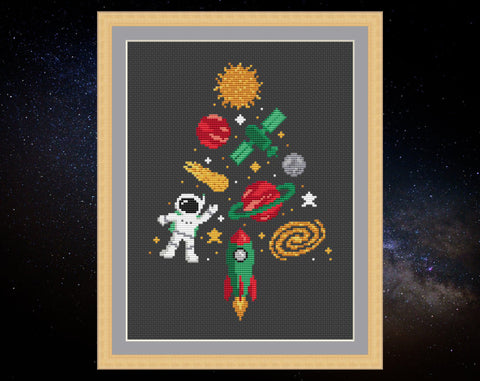 Space Christmas Tree cross stitch pattern - xmas tree shape made up of sun, planets, moon, stars, satellite, astronaut, galaxy and rocket motifs. Shown with frame.
