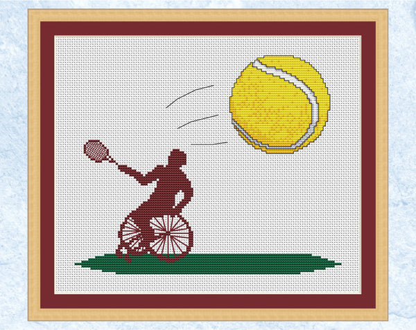 Wheelchair Tennis cross stitch pattern. Silhouette of a Wheelchair Tennis player hitting a tennis ball coming towards you. Shown with frame.