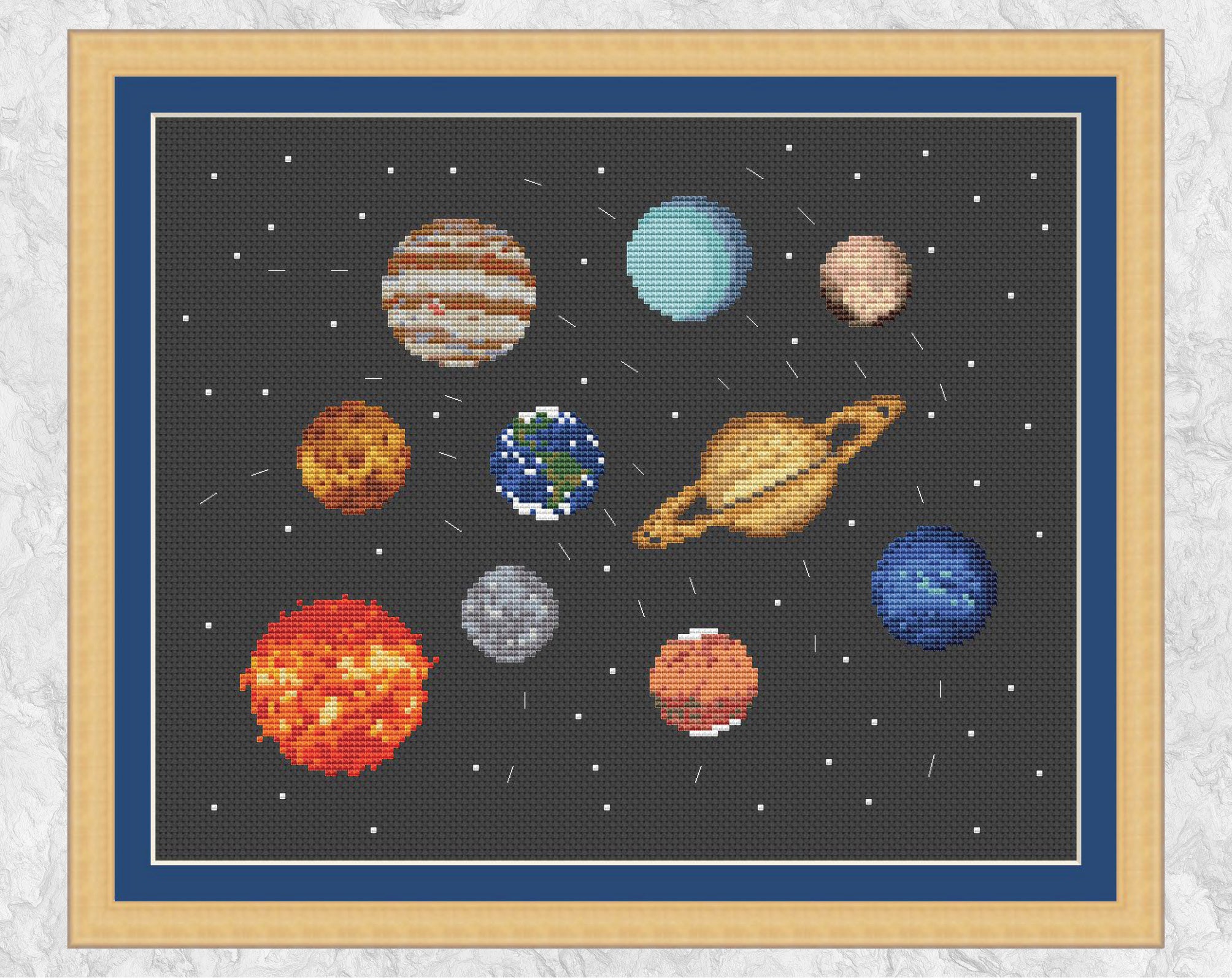Cross stitch pattern of all the planets in the Solar System, along with the Sun and Pluto. Dashed lines indicate the orbits of the planets (not to scale). The planets are accurately designed from NASA images as much as possible given the limitations of size. Shown with frame.