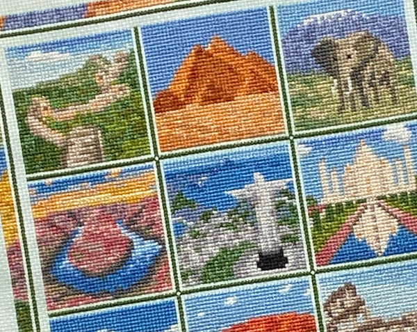 Travel the World cross stitch pattern. Close up of Great Wall of China, Egyptian Pyramids, African Elephant and Mount Kilimanjaro, Horseshoe Bend in the Grand Canyon, Christ the Redeemer in Rio de Janeiro, and the Taj Mahal in India.
