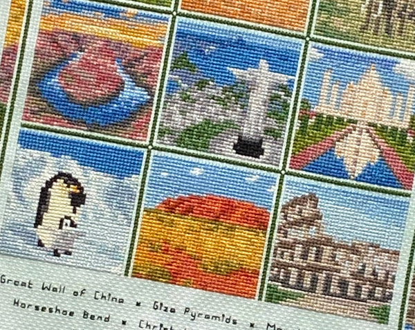 Travel the World cross stitch pattern. Close up of Antarctica penguin and chick, Uluru in Australia, and the Colosseum in Rome, Italy.