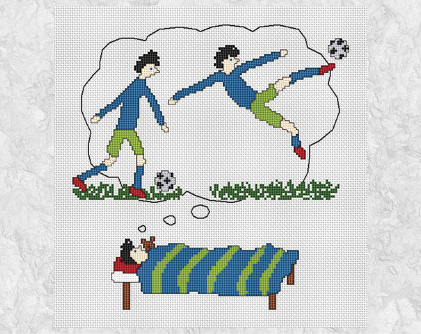Footballing Dreams cross stitch pattern - picture of a boy lying in bed dreaming of becoming a top football or soccer player - shown without frame