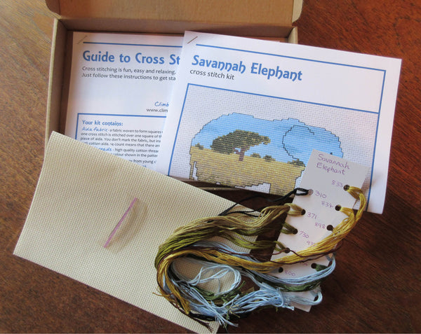Elephant cross stitch kit - everything you need to stitch a silhouette of an elephant filled with a scene of the African savannah. Contents of kit.