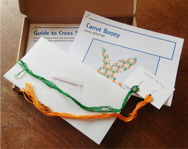 Carrot Bunny cross stitch kit - silhouette of a rabbit filled with carrots. Picture of box contents.