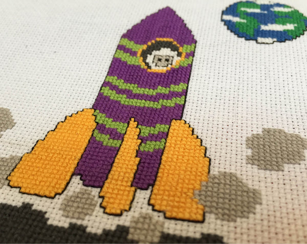 Cartoon Space Rocket cross stitch pattern - angled view of stitched piece