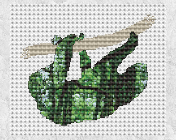 Evocative cross stitch pattern of a sloth filled with a scene of the rainforest, full of trees, leaves and tangled vines. Shown without frame.
