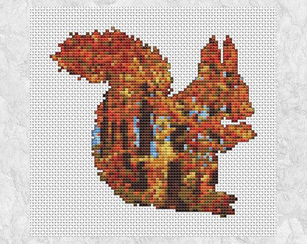 Cross stitch pattern of a squirrel filled with a scene of richly coloured autumn woodland - without frame