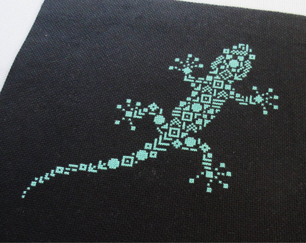 Geometric Gecko cross stitch pattern - stitched piece on black