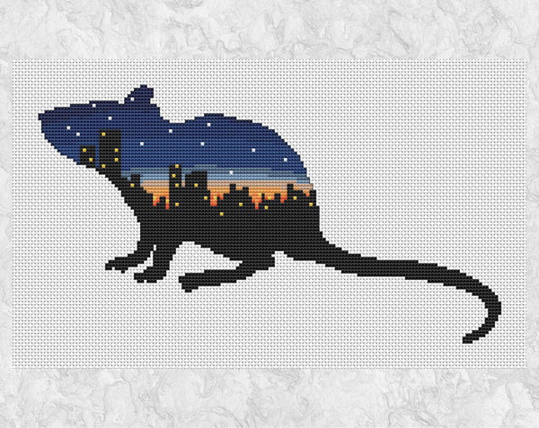 Cross stitch pattern of the silhouette of a rat filled with the scene of a city at twilight. Without frame.