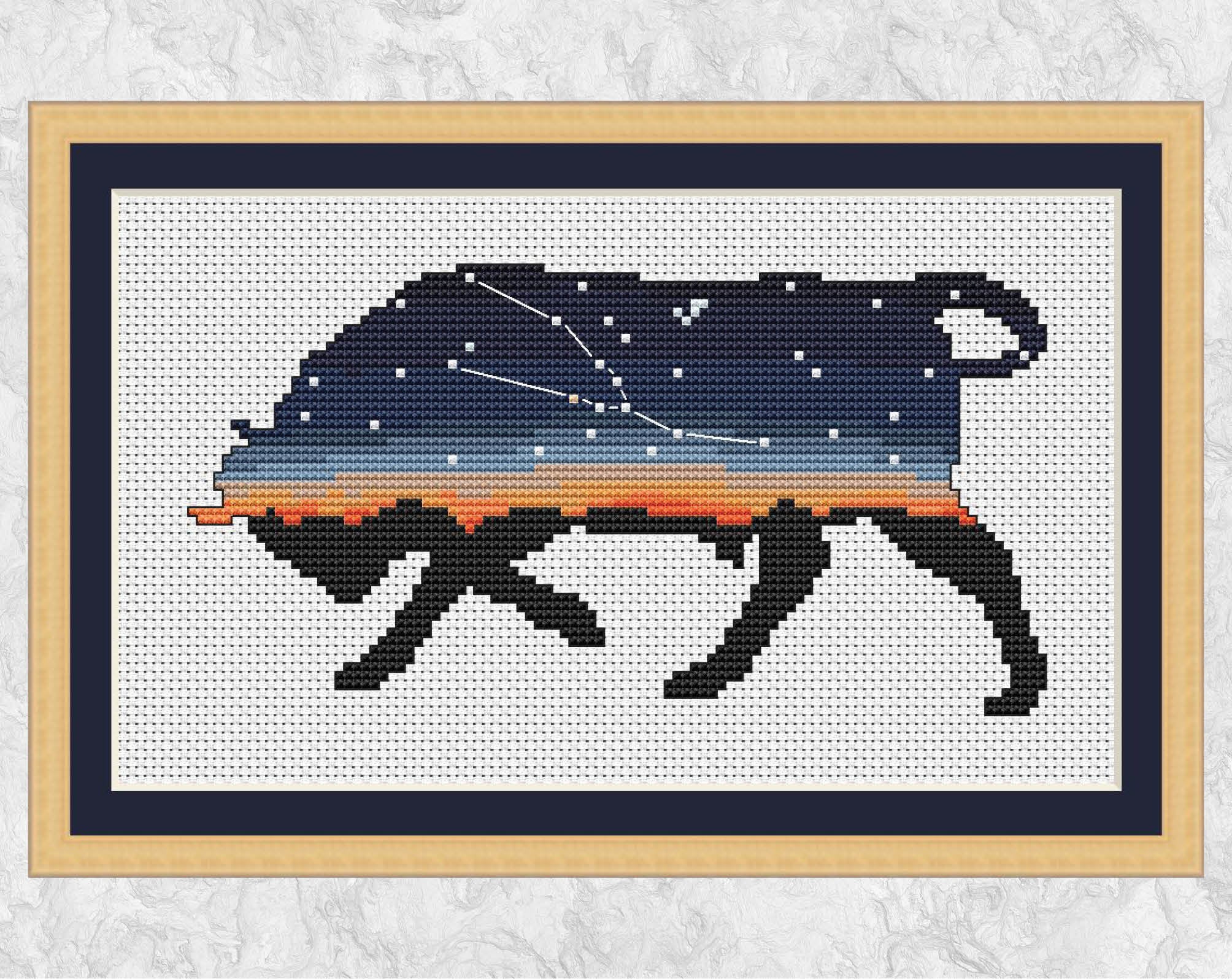 Taurus cross stitch pattern - outline of a bull with the Taurus constellation inside the silhouette. Astronomy or space pattern or for those with Taurus star sign. Shown with frame.