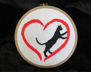 Cross stitch pattern PDF of a cat climbing inside a heart - stitched piece in hoop