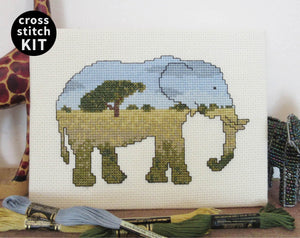 Elephant cross stitch kit - everything you need to stitch a silhouette of an elephant filled with a scene of the African savannah. Stitched piece with props.