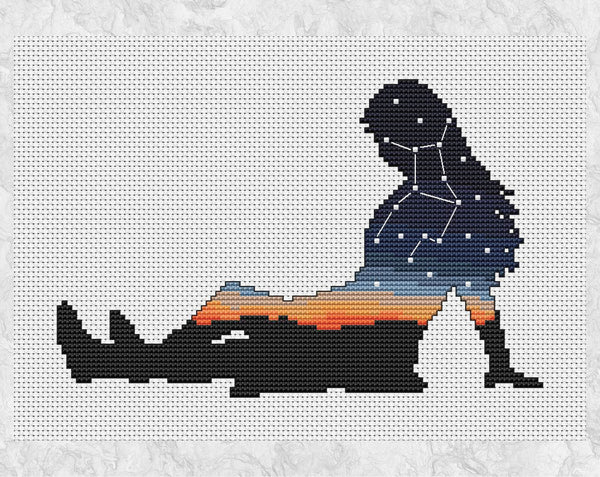Cross stitch pattern of the silhouette of a woman, filled with the zodiac constellation of Virgo above a sunset. Shown without frame.