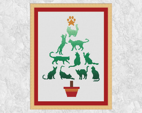 Cat Christmas Tree cross stitch pattern (larger) - silhouettes of ten cats with paw print star at the top forming the shape of a Christmas tree. With frame.