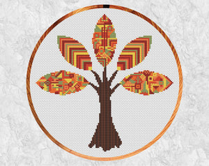 Patterned Autumn Tree cross stitch pattern - fall forest design. Shown with hoop.