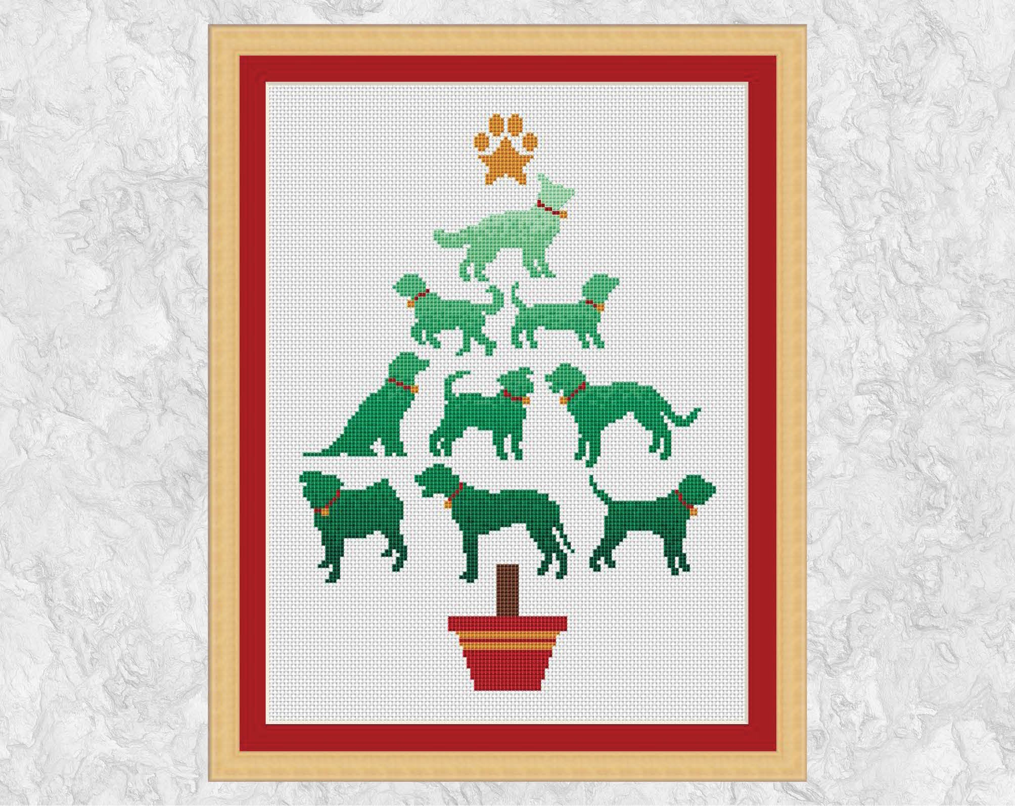 Cross stitch pattern PDF of a Christmas tree made up of dog breeds - perfect for any dog lover! Shown with frame.