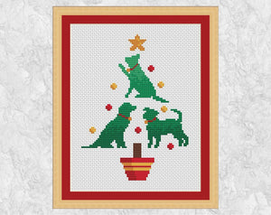 Cross stitch pattern PDF of a Christmas tree made up of dogs - perfect for any dog lover! Card sized version with three dog silhouettes. Shown with frame.