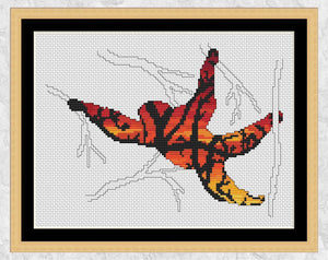 Cross stitch pattern PDFs of an orangutan swinging through a rainforest, filled with a scene of tangled vines against a vibrant sunset. Shown with frame.
