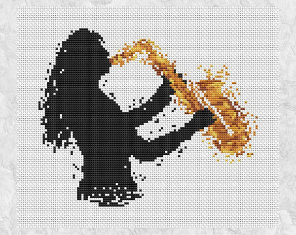 Cross stitch pattern of splattered paint female saxophonist. Shown without frame.