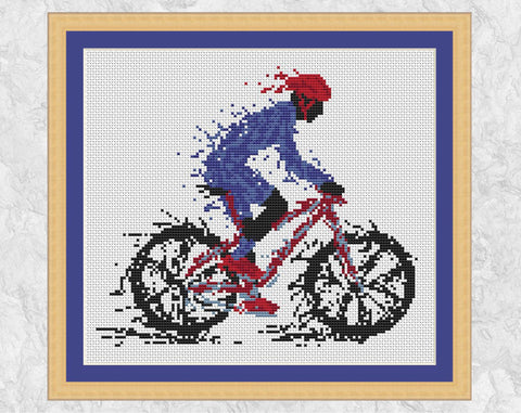 Splattered Paint Cyclist cross stitch pattern with frame