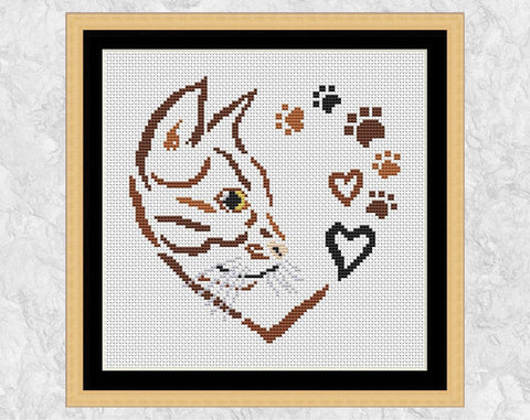 Cross stitch pattern PDF of a cat, hearts and paw prints forming a larger heart. With frame.