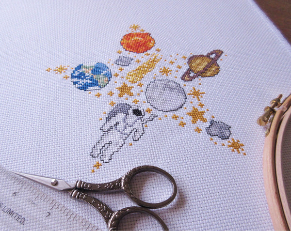 Space Star cross stitch pattern (astronaut version) - stitched image at an angle
