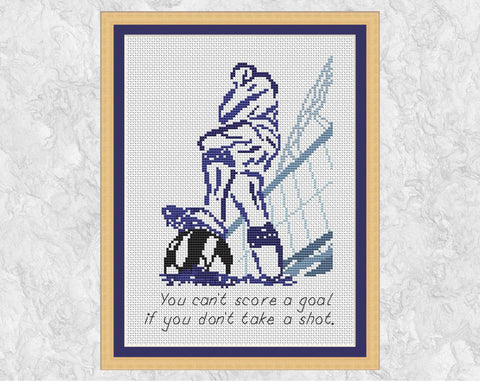 Cross stitch pattern of a modern take on the Bobby Moore statue outside the famous Wembley Stadium, and with the Wembley Arch in the background. A fun pattern for any aspiring football or soccer player! - with frame