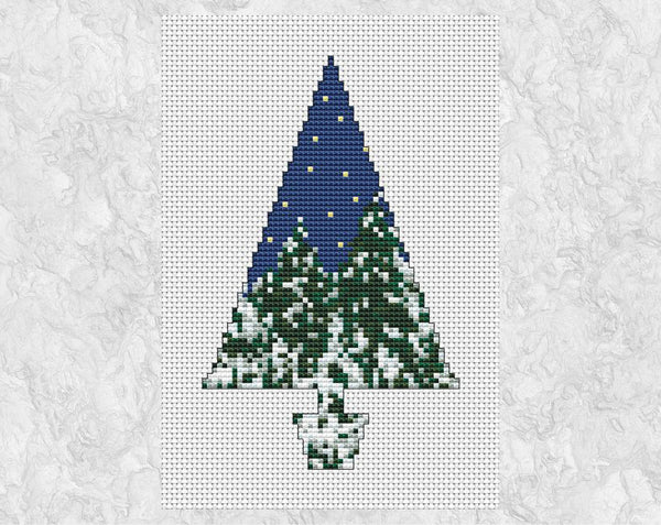 Cross stitch pattern of a tree silhouette filled with a scene of a snowy forest