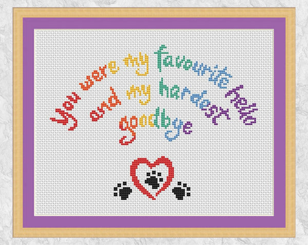 Cross stitch pattern of the words 'You were my favourite hello, and my hardest goodbye' in the shape of a rainbow, with a heart and paw prints. UK spelling version in frame.