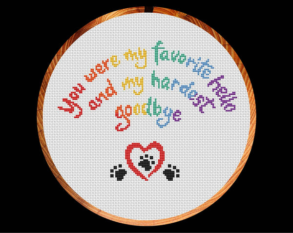 Cross stitch pattern of the words 'You were my favourite hello, and my hardest goodbye' in the shape of a rainbow, with a heart and paw prints. US spelling version in hoop.