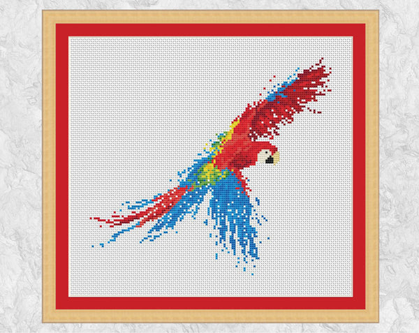 Splattered Paint Parrot cross stitch pattern - on white with frame