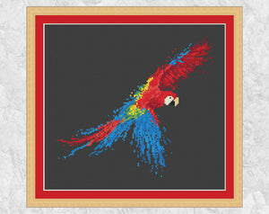 Splattered Paint Parrot cross stitch pattern - on black with frame
